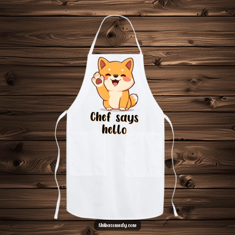 Funny Shiba Inu apron featuring a cheerful dog with its paw raised in a greeting, perfect for cooking.