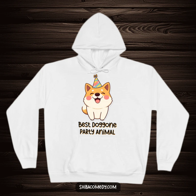 Funny hoodie featuring a happy Shiba Inu wearing a party hat and wagging its tail, embodying pure festive canine joy.