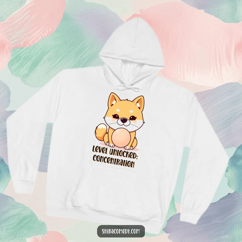 Funny Shiba Inu hoodie depicting a dog with extreme focus trying to balance a ball on its nose, super humorous design.
