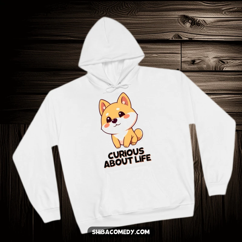 Funny Shiba Inu dog character with a curious head tilt and one ear up on a cozy hoodie, perfect for warm contemplation.