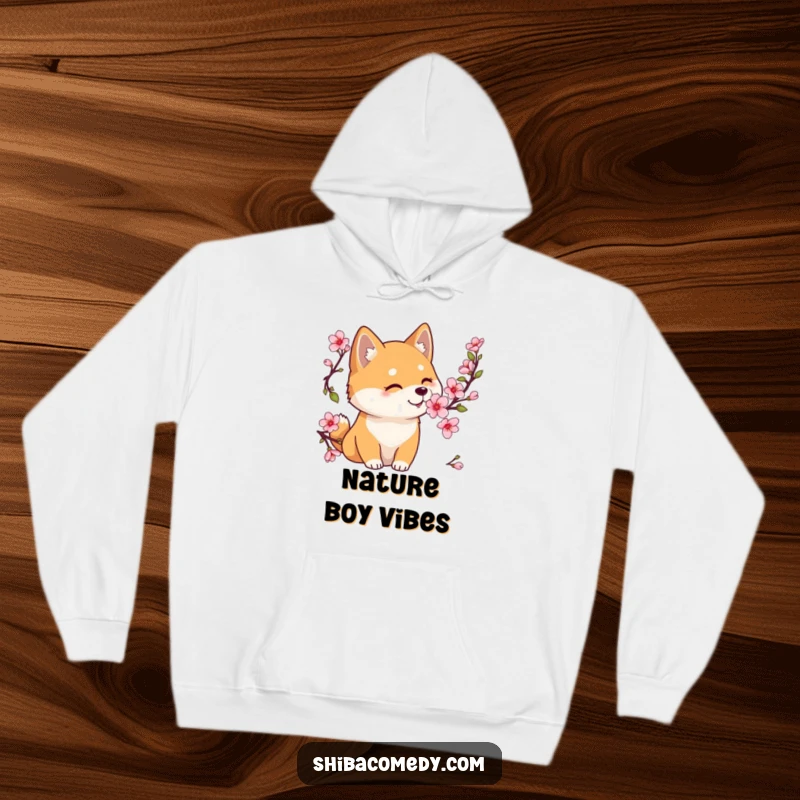 Funny Shiba Inu hoodie featuring a gentle dog sniffing a cherry blossom, offering comfort and peaceful contemplation.