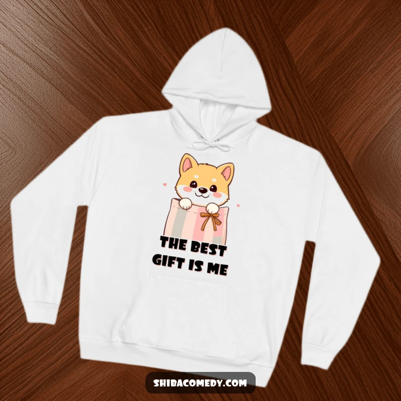 Funny hoodie featuring a curious Shiba Inu dog peeking its head out from a gift bag, offering a hint of playful mystery.