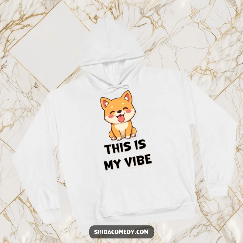 Funny Shiba Inu hoodie showing a playful dog sitting with its tongue out, exuding warmth and happiness.